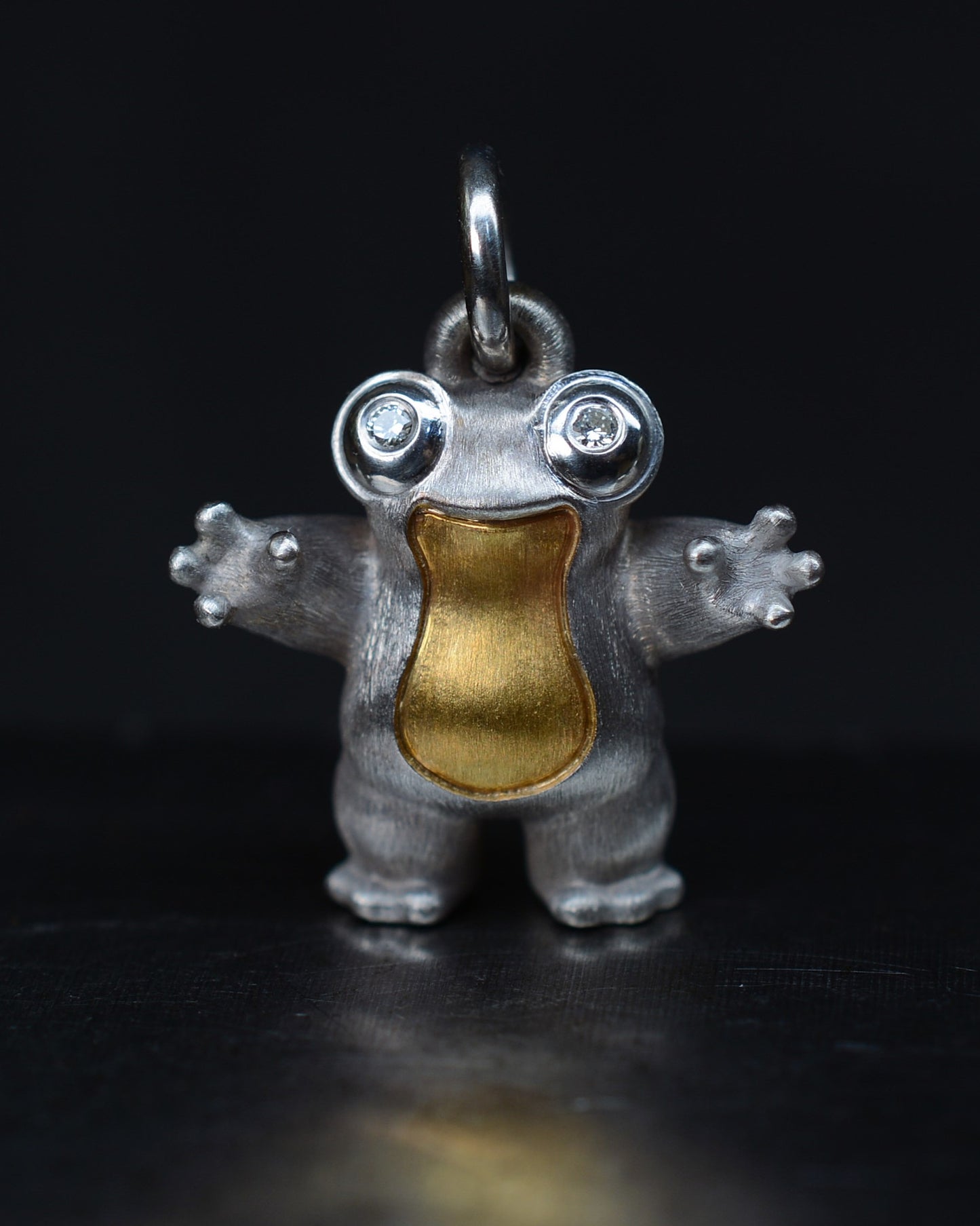 Frog type Bright Creature with diamond eyes and parcel gilt.