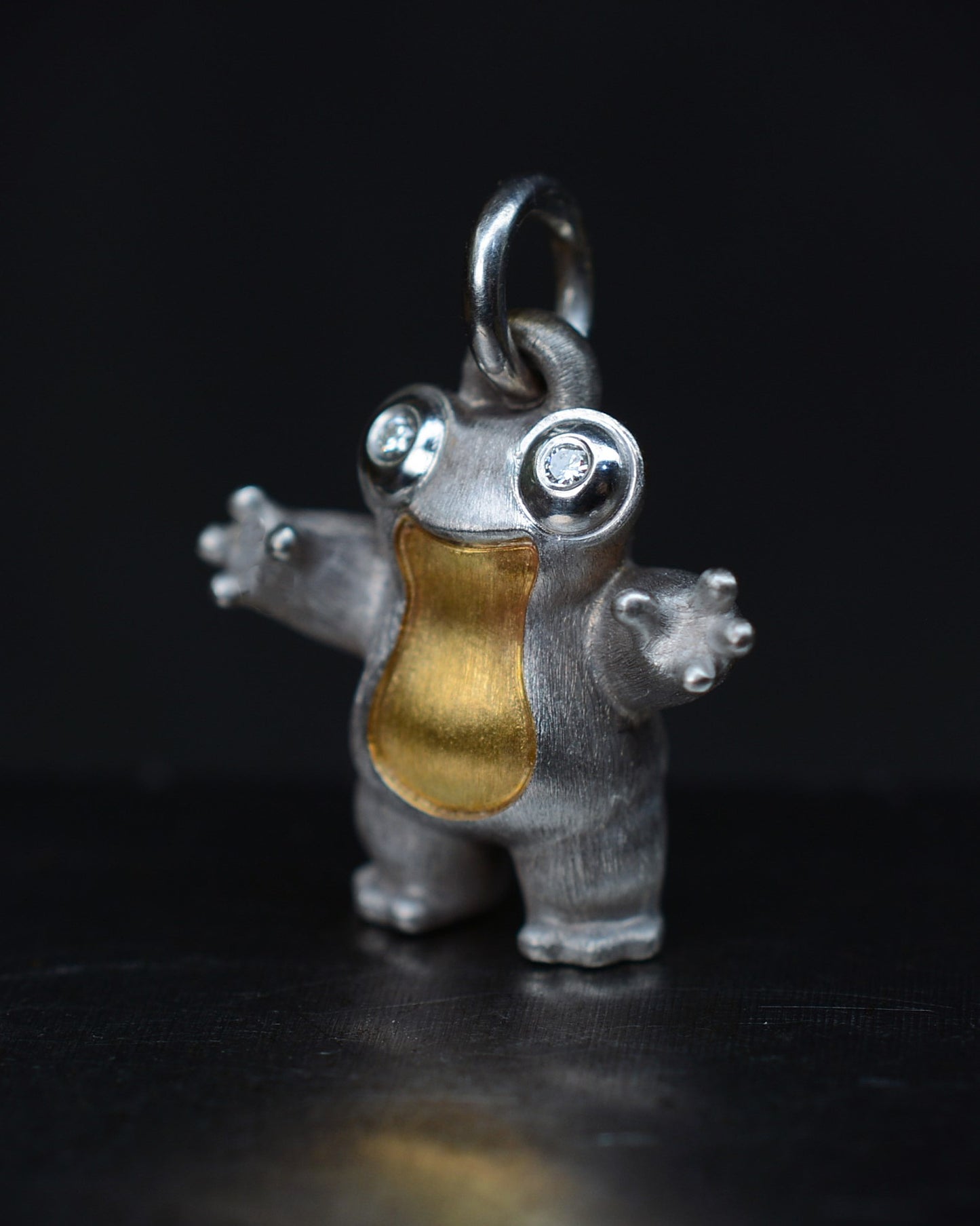 Frog type Bright Creature with diamond eyes and parcel gilt.