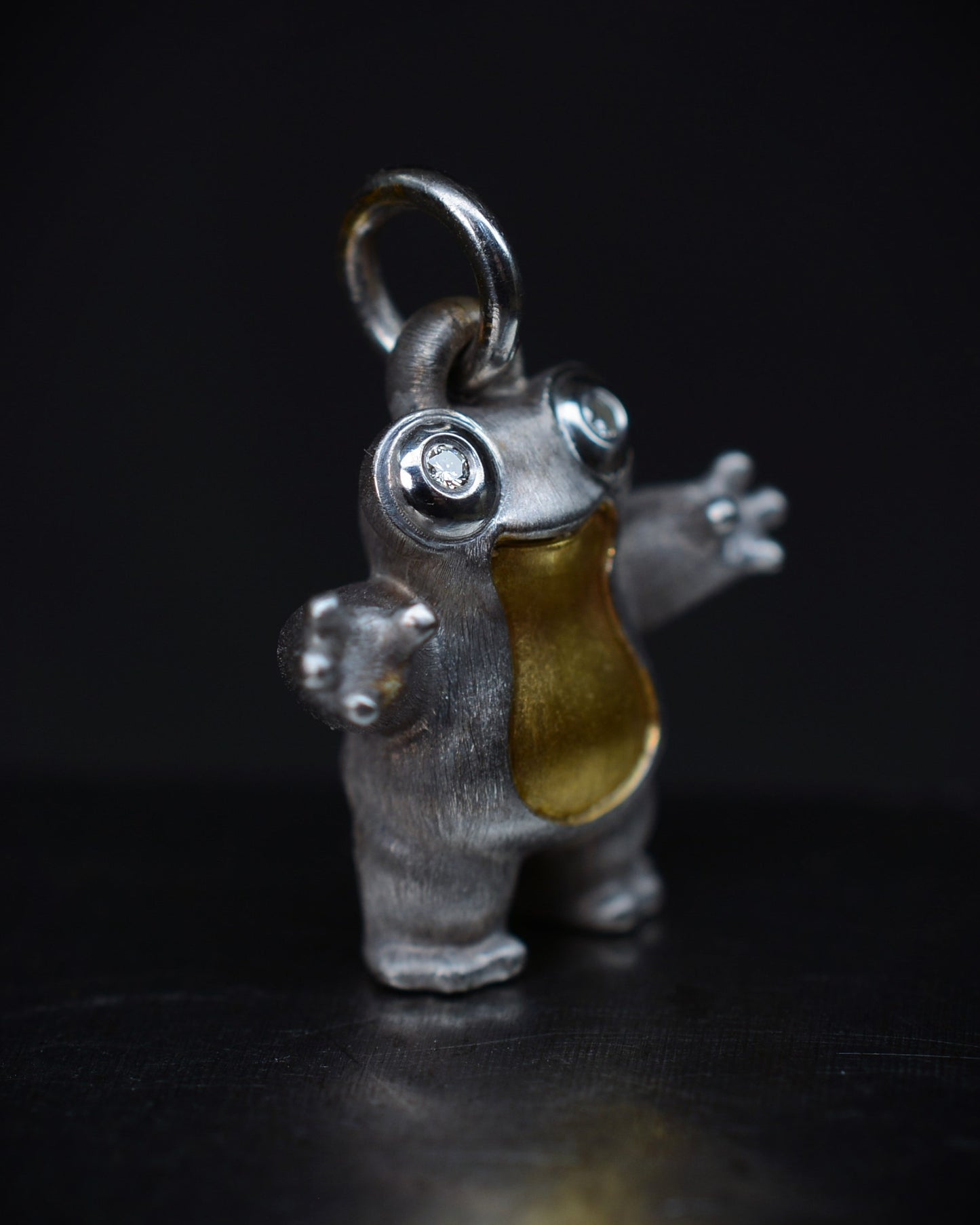 Frog type Bright Creature with diamond eyes and parcel gilt.