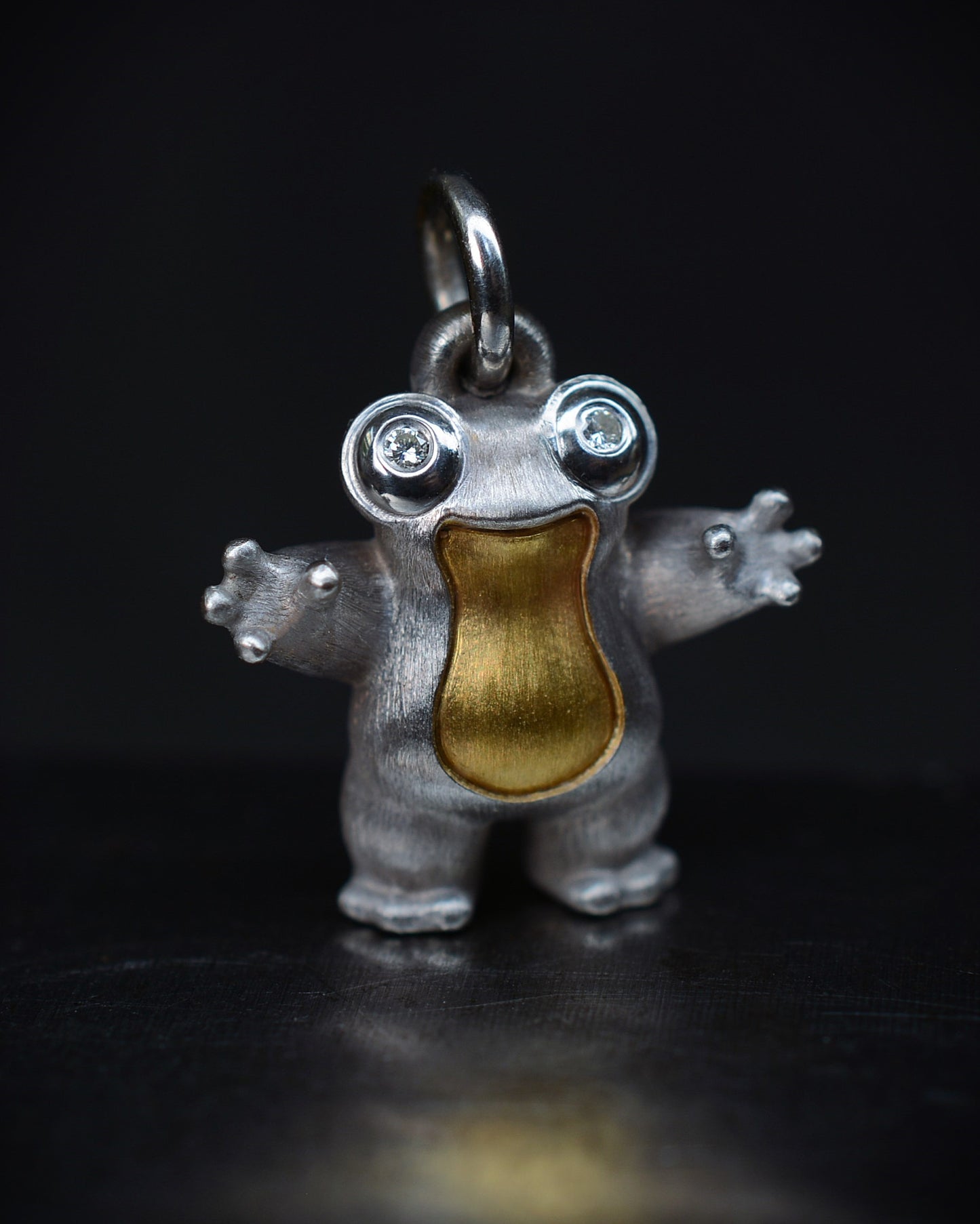 Frog type Bright Creature with diamond eyes and parcel gilt.