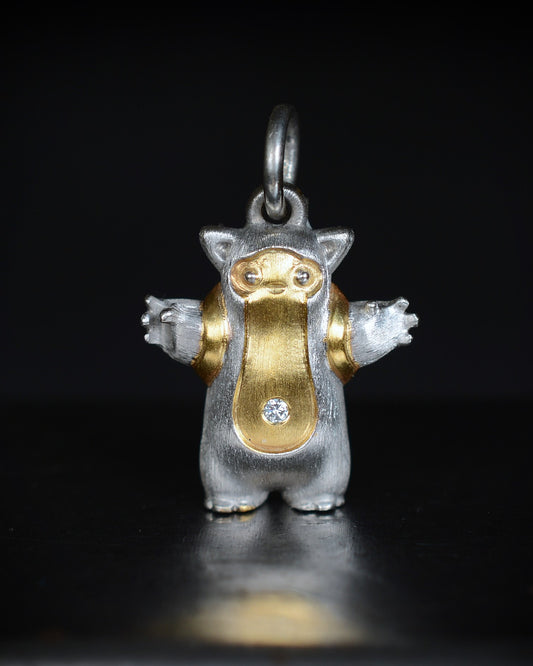 Fox eared, pear shaped, backpacker Bright Creature with a diamond and parcel gilt.