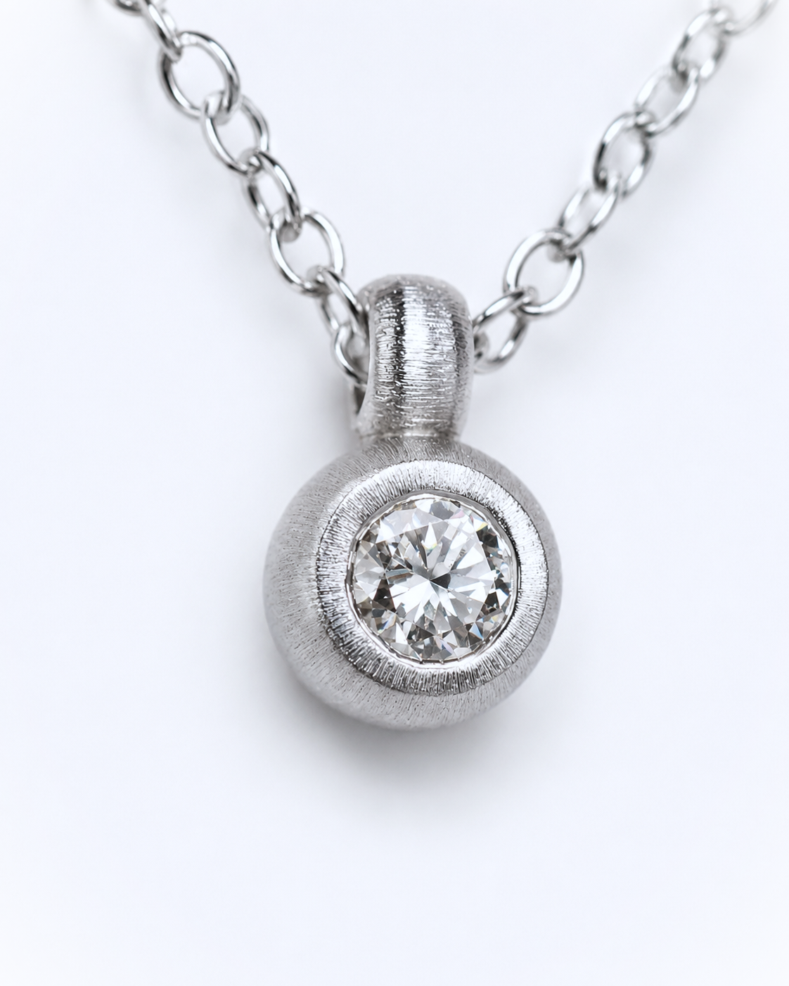 Pendant featuring a 0.36ct transitional-cut diamond reclaimed from vintage jewellery.