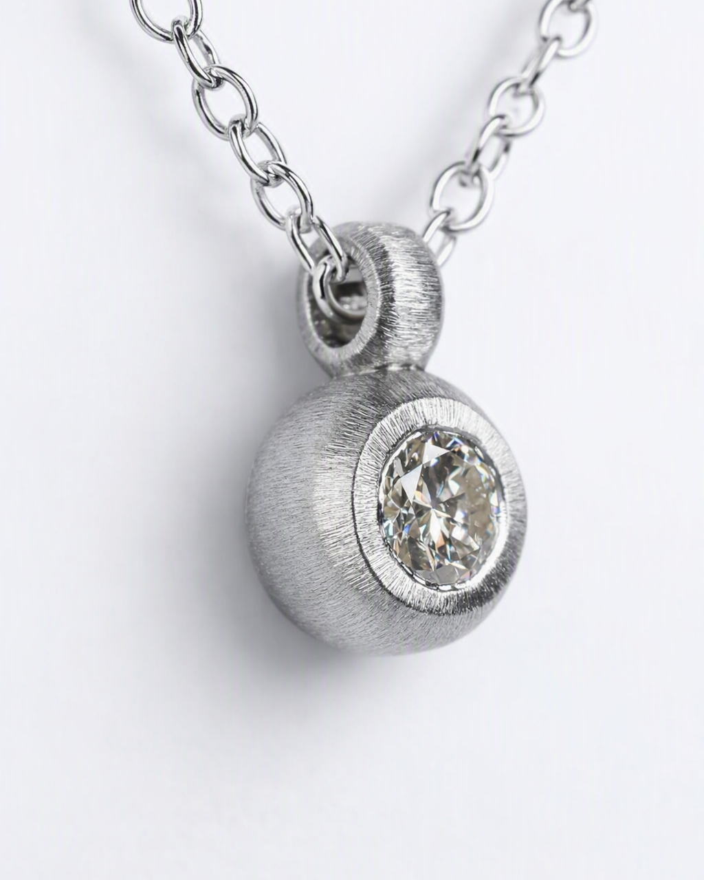 Pendant featuring a 0.36ct transitional-cut diamond reclaimed from vintage jewellery.