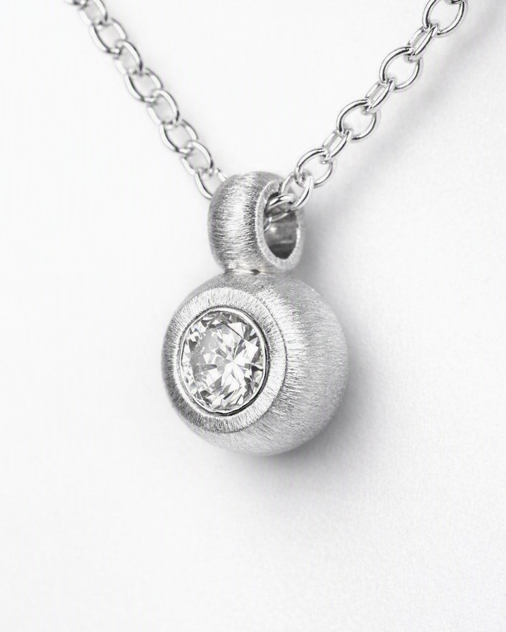 Pendant featuring a 0.36ct transitional-cut diamond reclaimed from vintage jewellery.