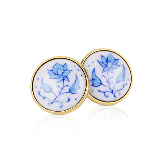 Enamelled gold and silver earrings with a floral motif.