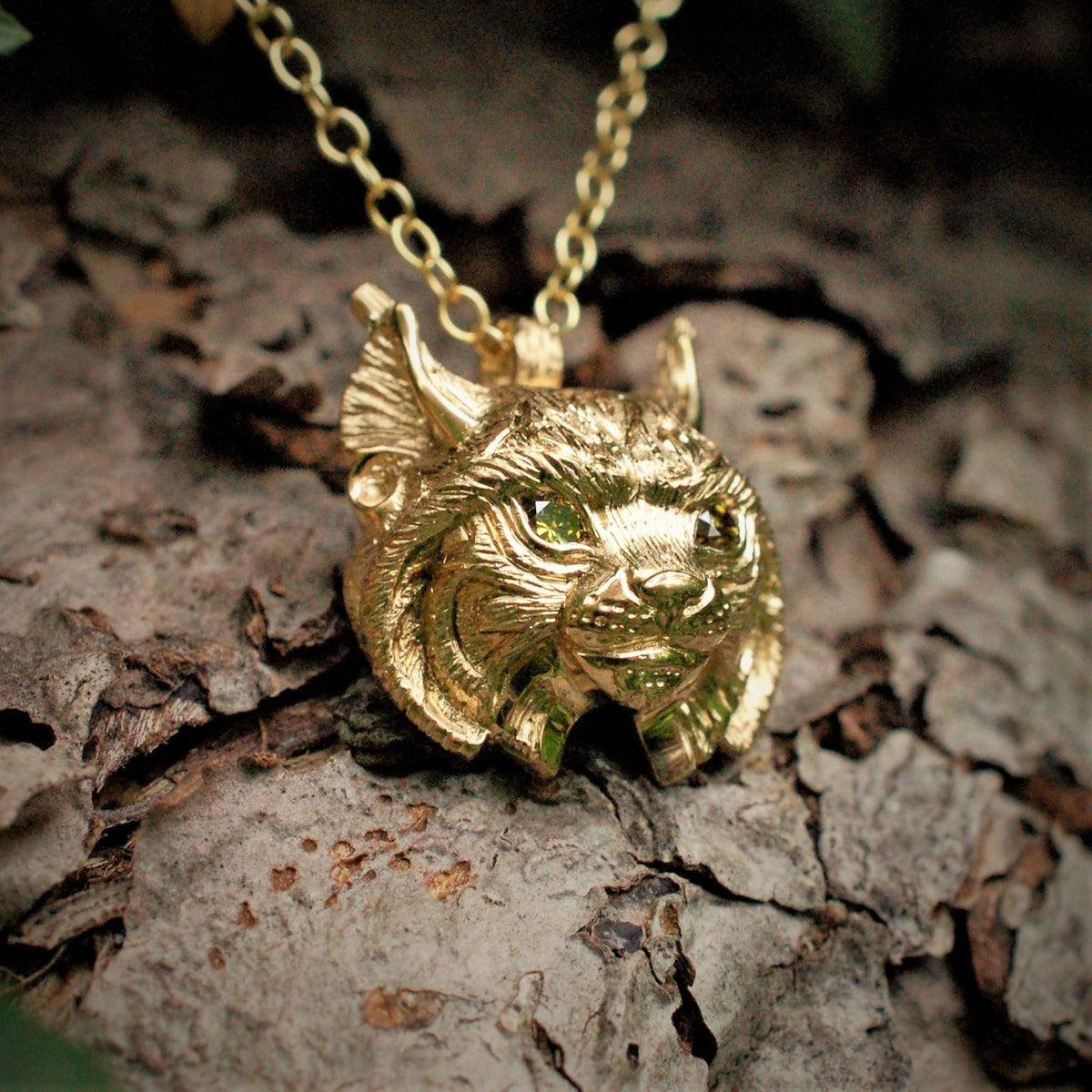 Gold lynx head pendant with diamond eyes and a gold chain. *This piece is finished and ready to be shipped*