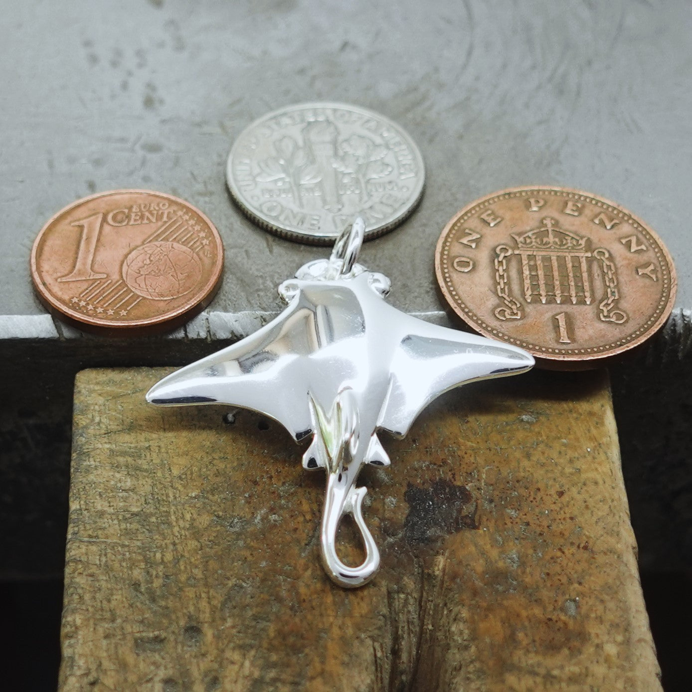 Manta Ray necklace. Made from highly polished, tarnish resistant silver, strung on a strong cord. © Adrian Ashley
