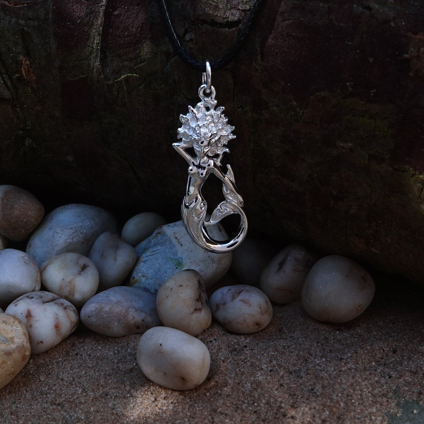 Mermaid necklace. Made from highly polished, tarnish resistant silver, strung on a strong cord. © Adrian Ashley