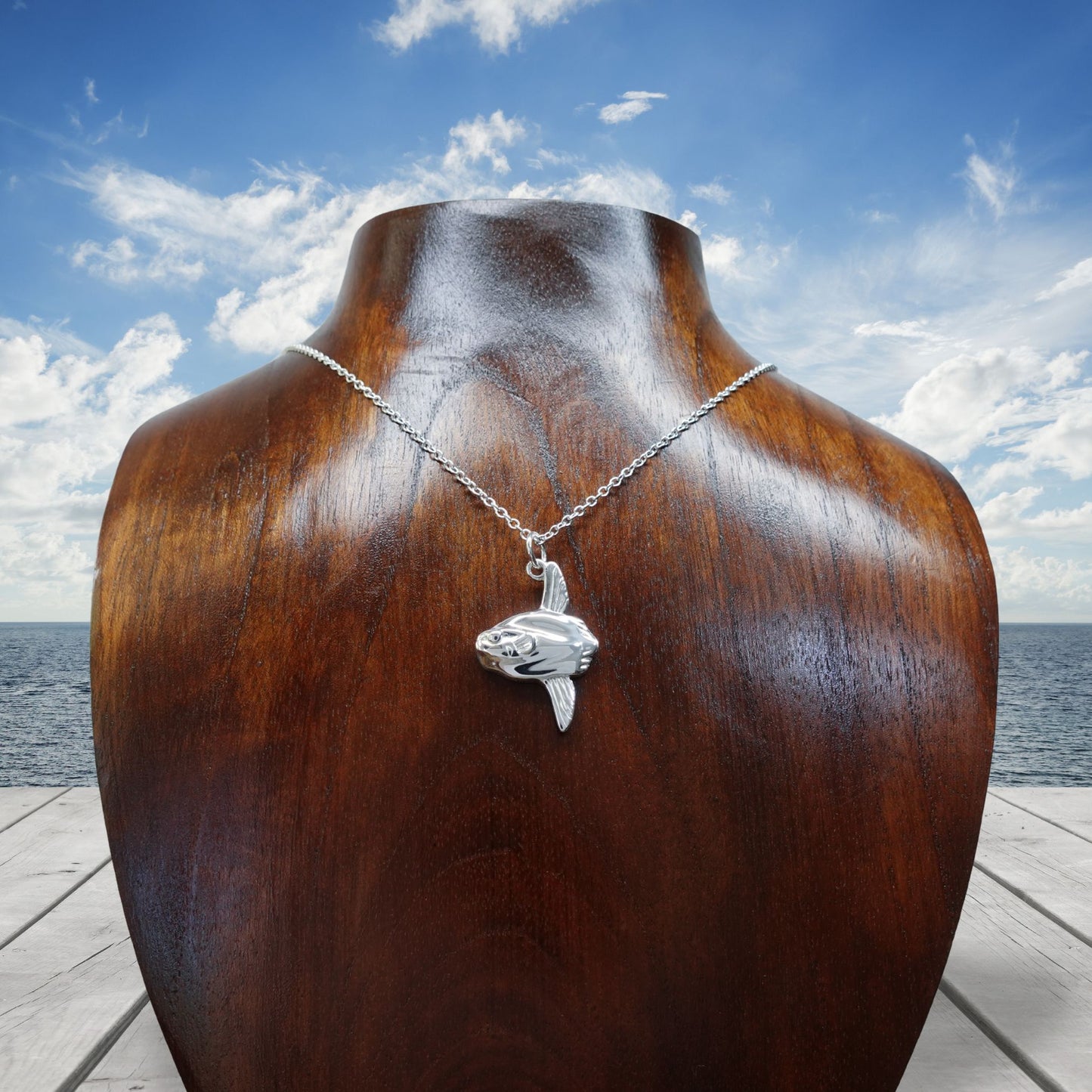 Mola Mola necklace. Made from highly polished, tarnish resistant silver, on a silver chain. © Adrian Ashley
