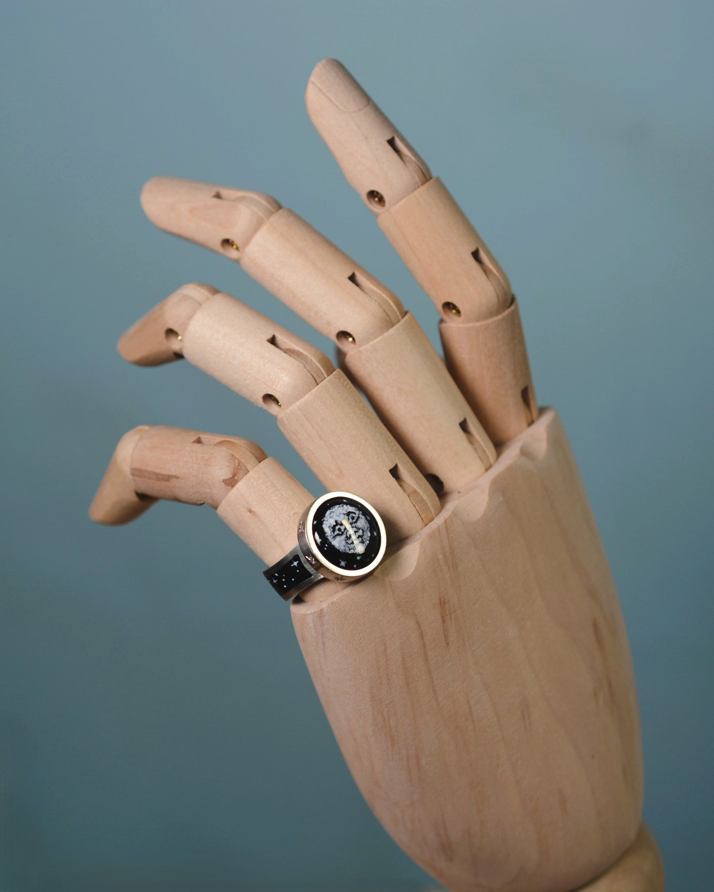 Enamel and diamond Man in the Moon ring.