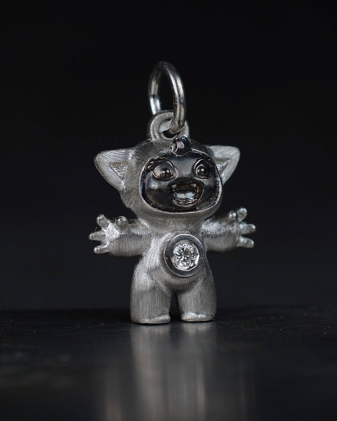 Noisy Bright Creature with black rhodium and a diamond-set belly.