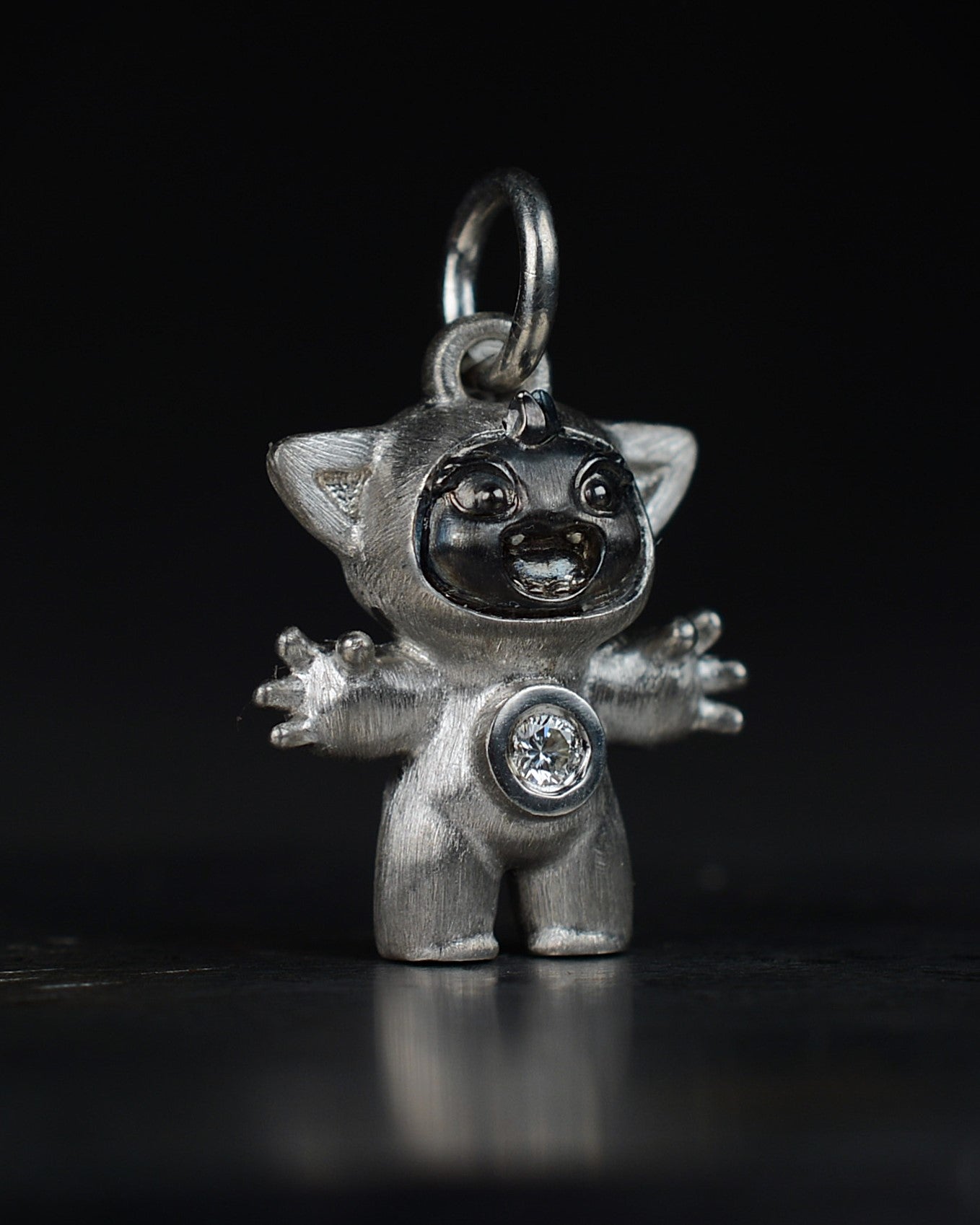 Noisy Bright Creature with black rhodium and a diamond-set belly.