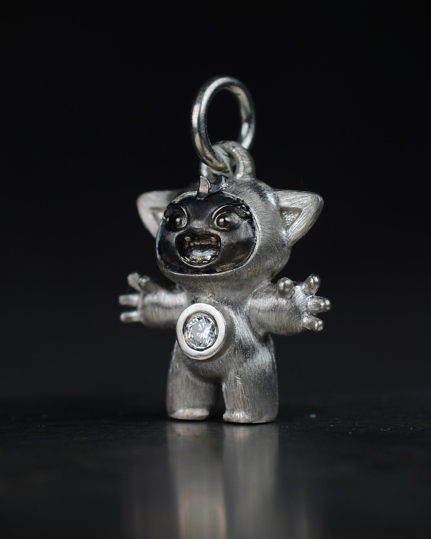 Noisy Bright Creature with black rhodium and a diamond-set belly.