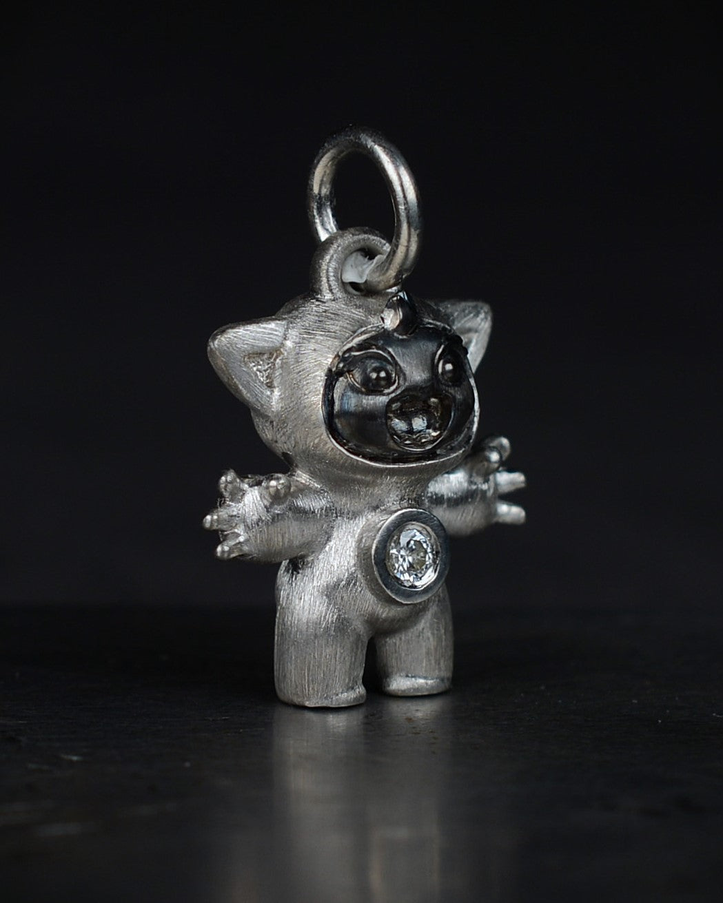 Noisy Bright Creature with black rhodium and a diamond-set belly.