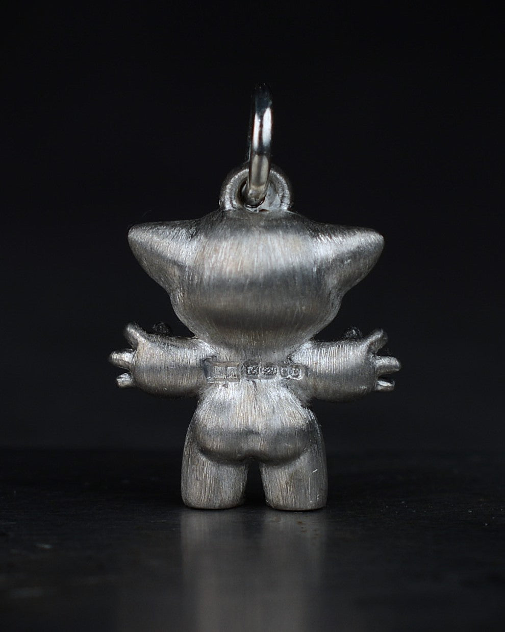 Noisy Bright Creature with black rhodium and a diamond-set belly.