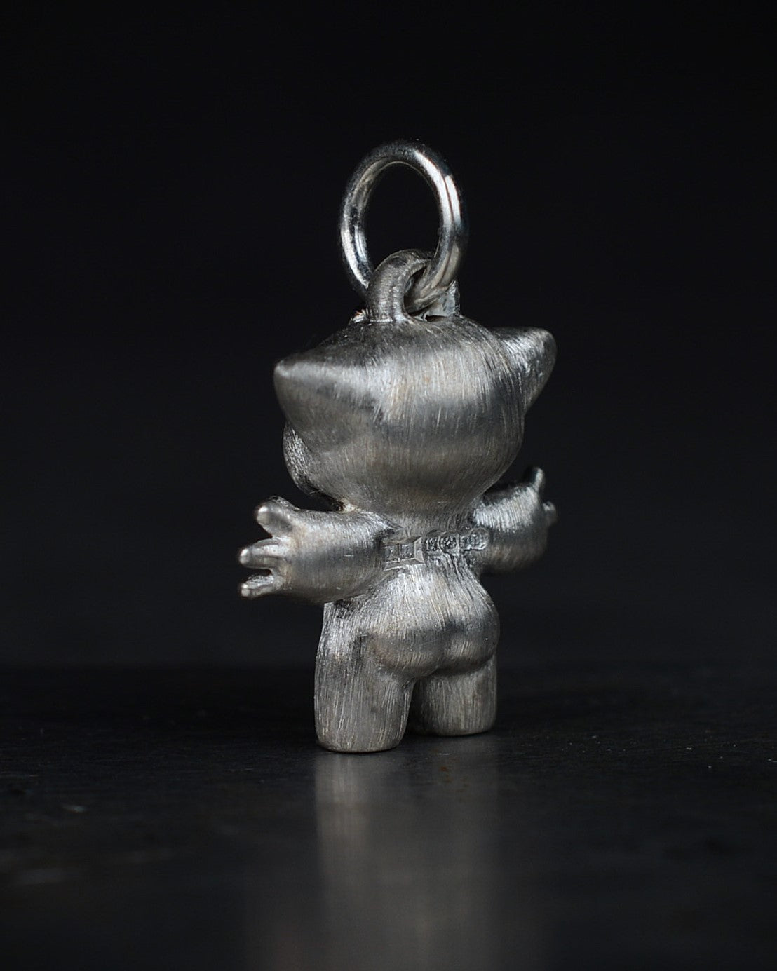 Noisy Bright Creature with black rhodium and a diamond-set belly.