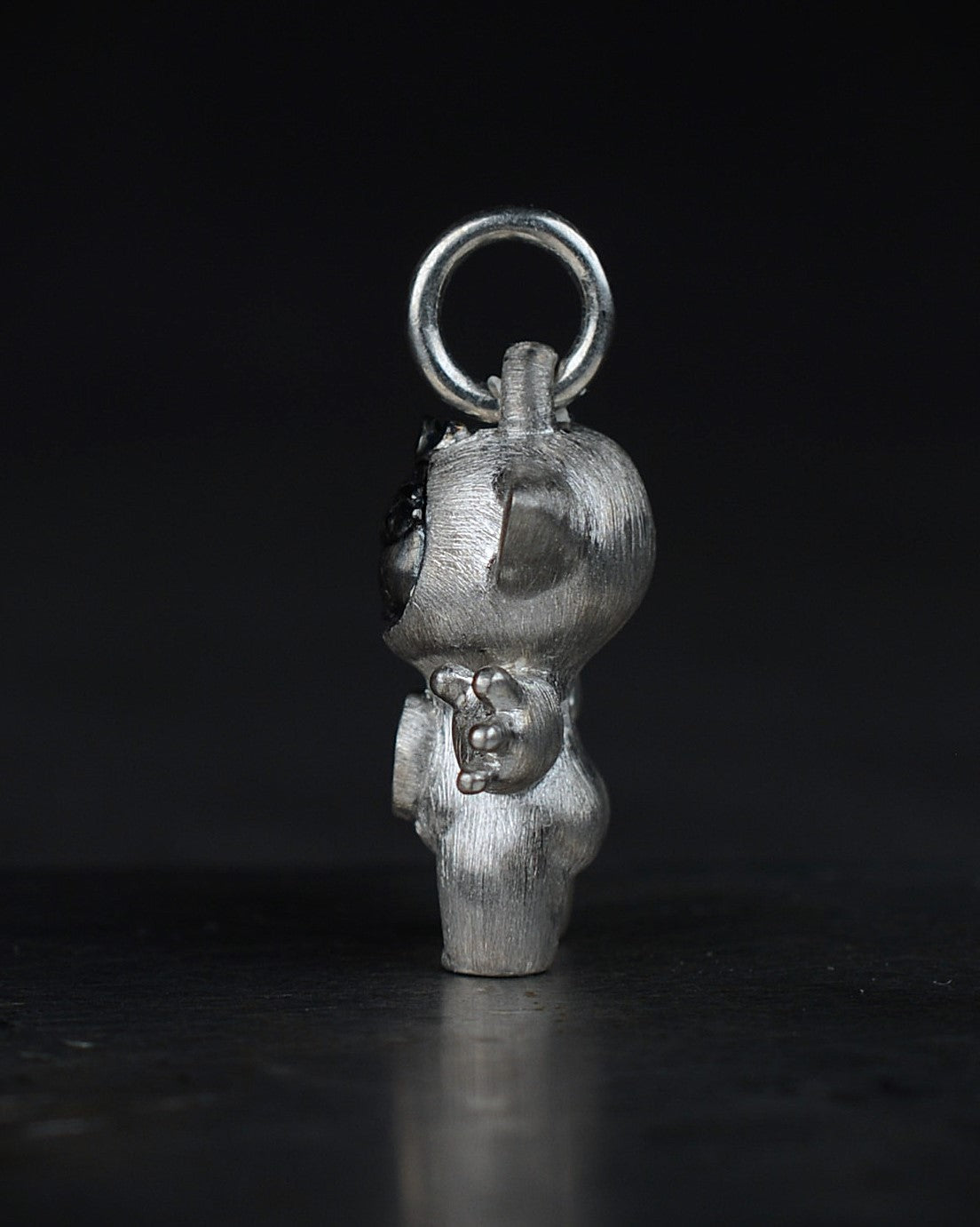 Noisy Bright Creature with black rhodium and a diamond-set belly.