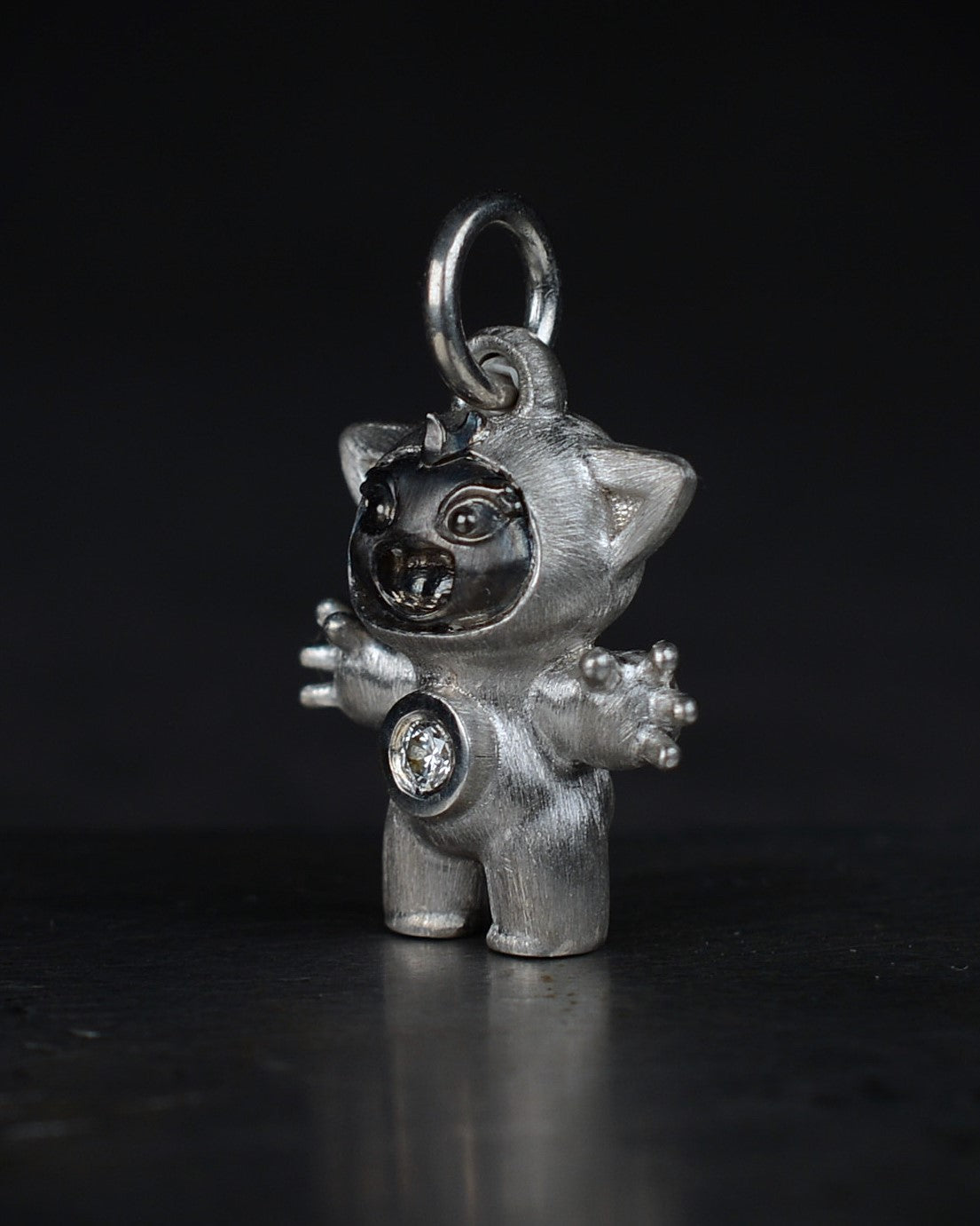 Noisy Bright Creature with black rhodium and a diamond-set belly.