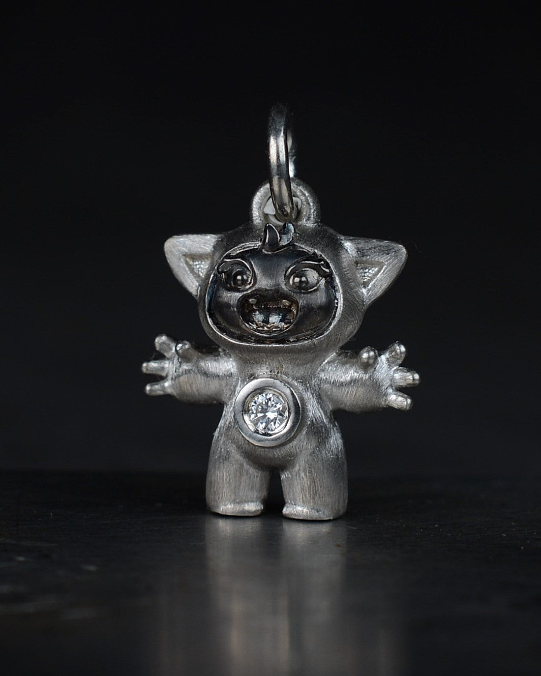 Noisy Bright Creature with black rhodium and a diamond-set belly.