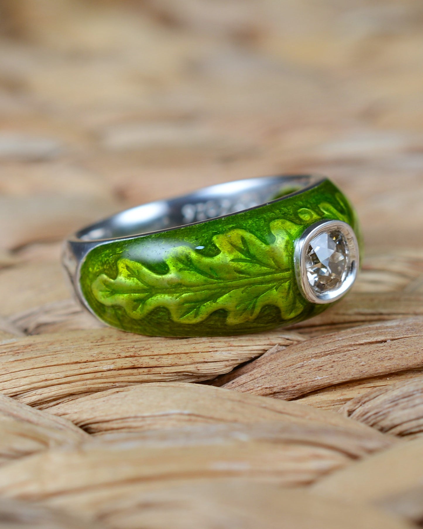 Old cut diamond ring with an enamelled oak leaf motif