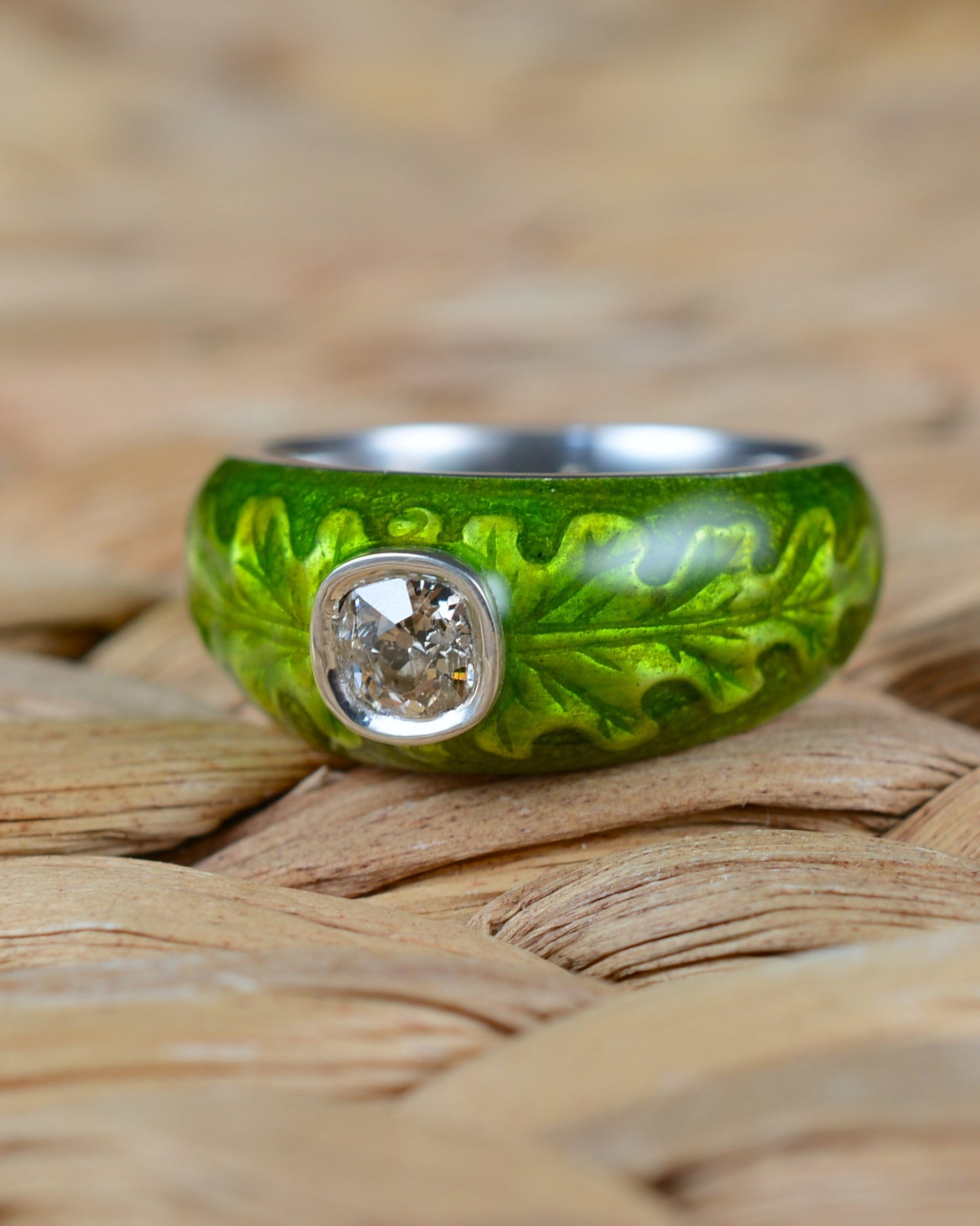 Old cut diamond ring with an enamelled oak leaf motif