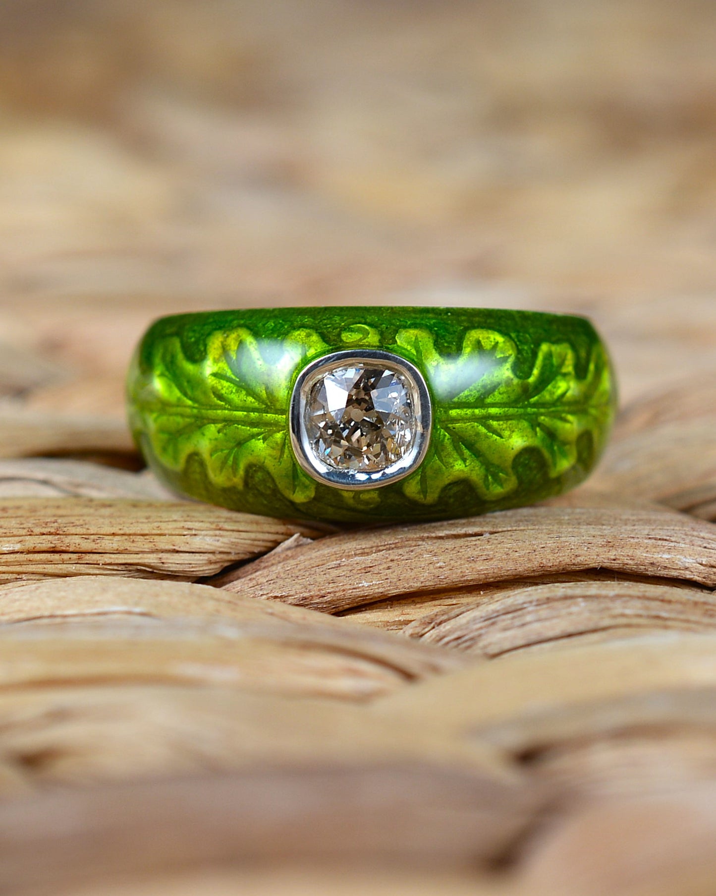 Old cut diamond ring with an enamelled oak leaf motif