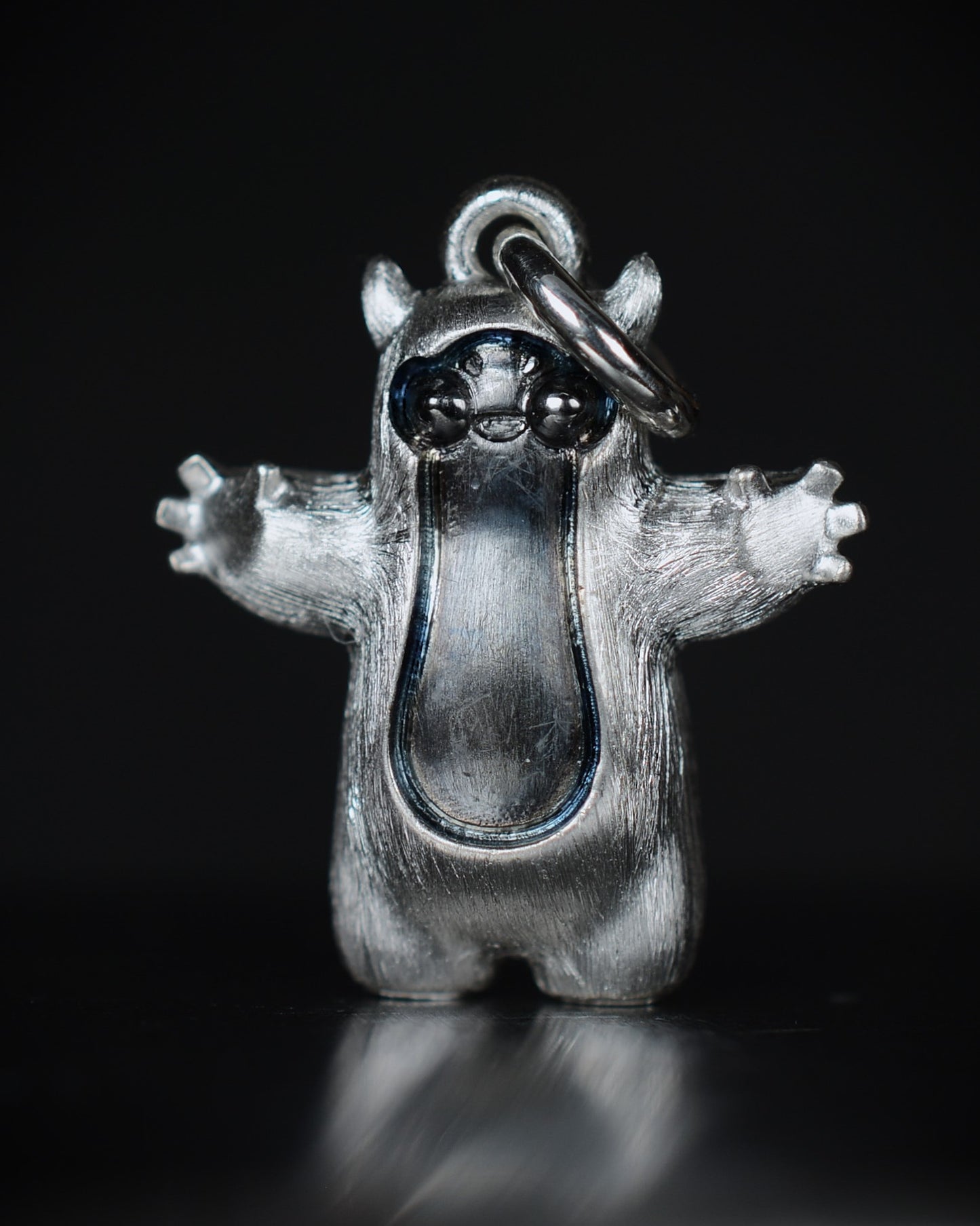 Pearshape Bright Creature Companion Being with black rhodium