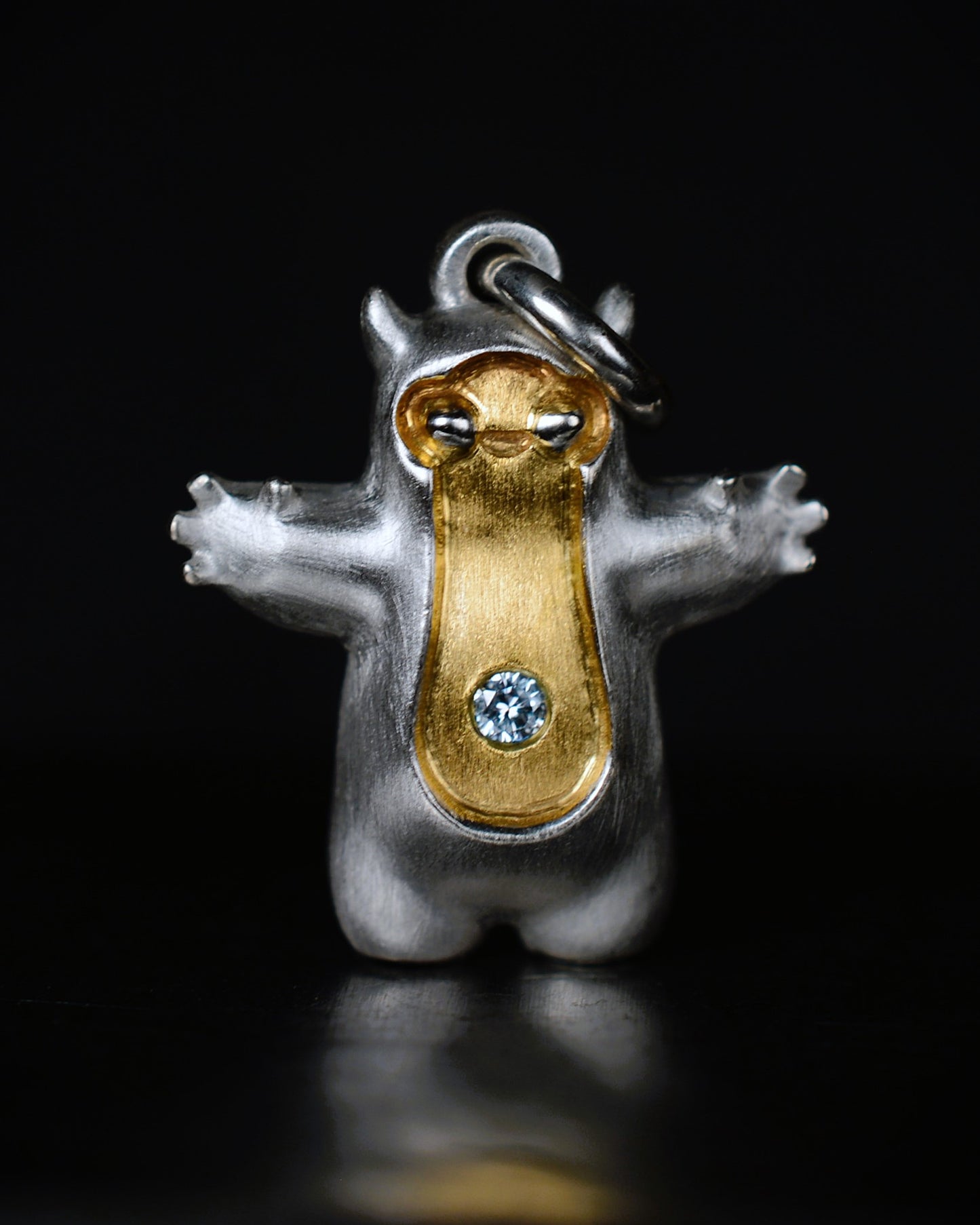Pearshape Bright Creature Companion Being with a diamond and parcel gilt.
