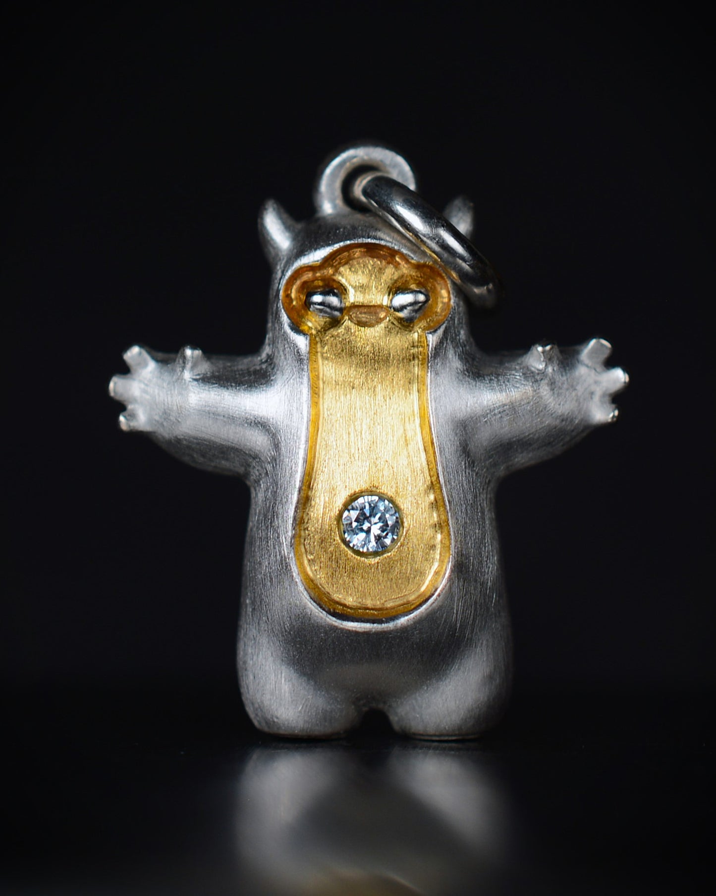 Pearshape Bright Creature Companion Being with a diamond and parcel gilt.