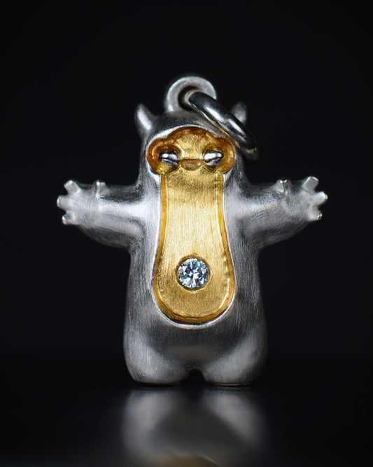 Pearshape Bright Creature Companion Being with a diamond and parcel gilt.
