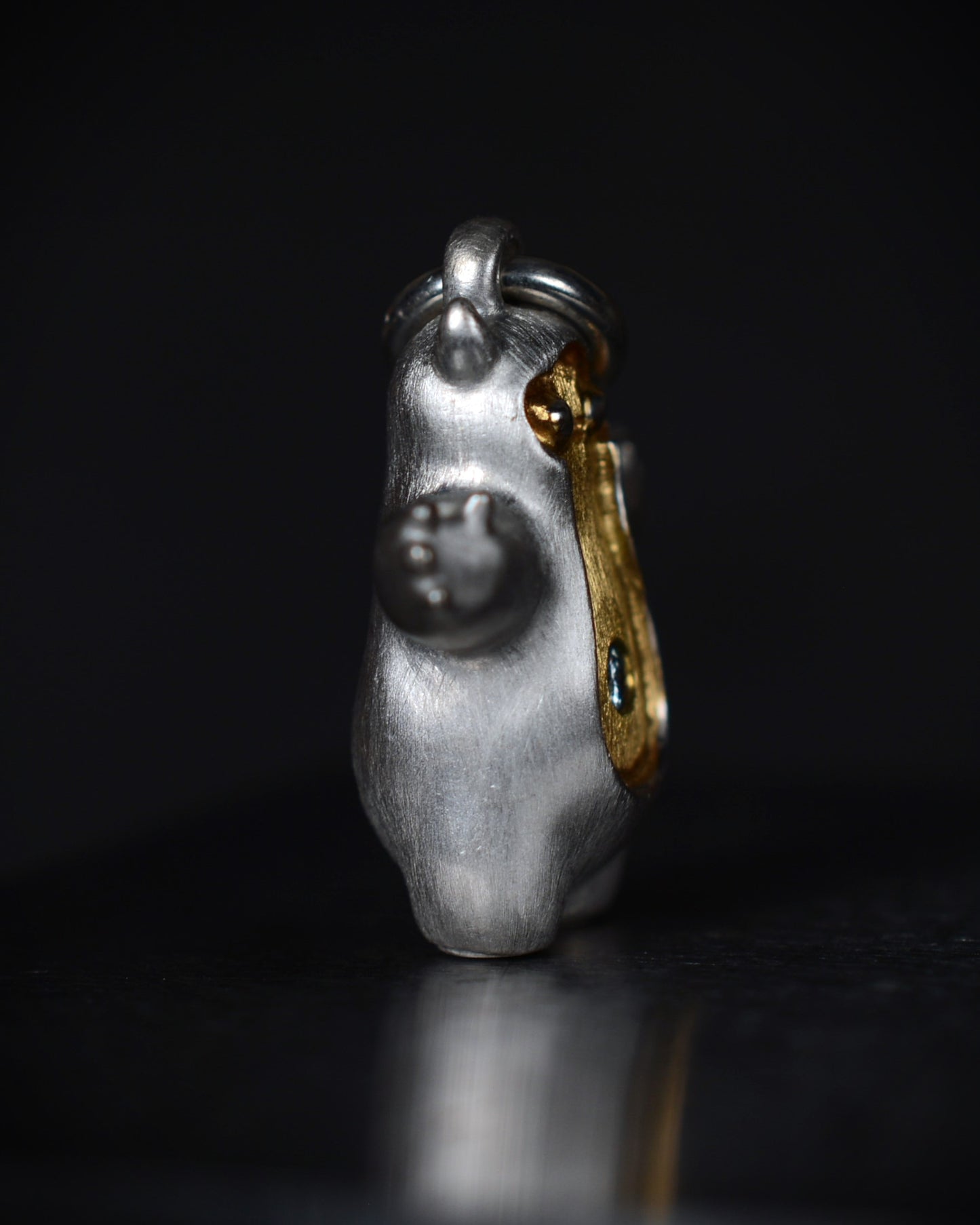 Pearshape Bright Creature Companion Being with a diamond and parcel gilt.