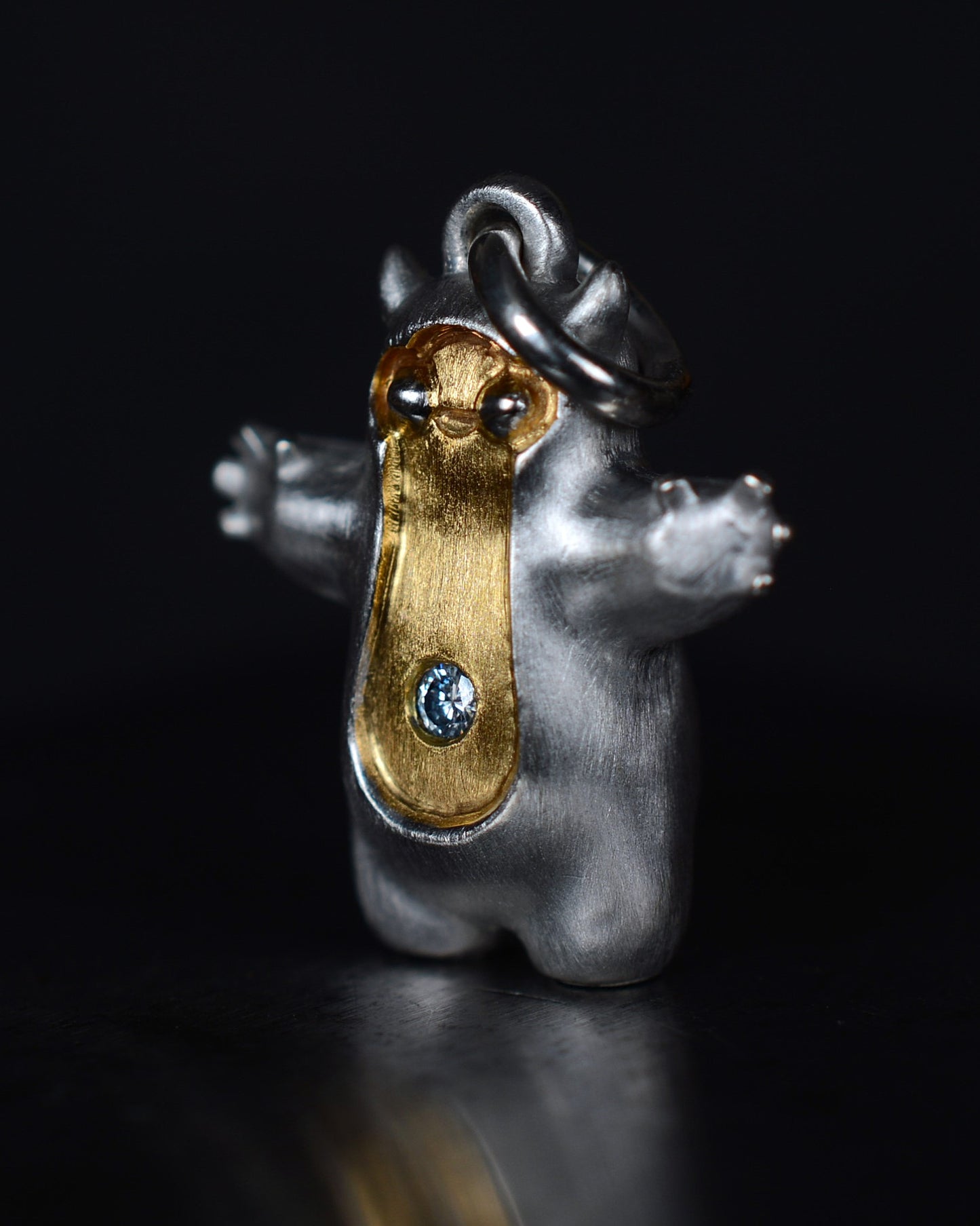 Pearshape Bright Creature Companion Being with a diamond and parcel gilt.