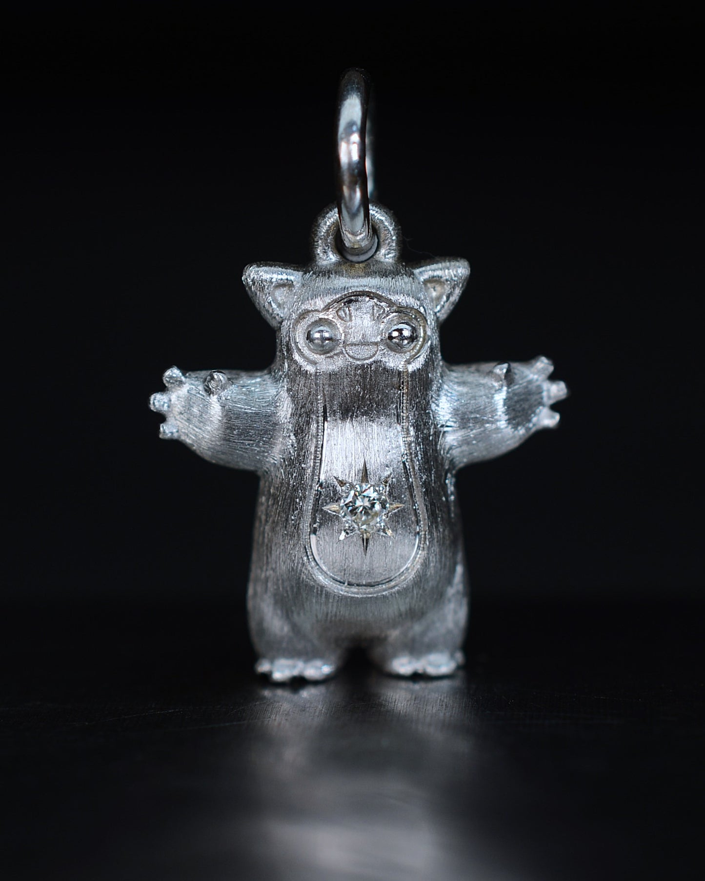 Fox eared pearshape small Bright Creature with a star set natural diamond.