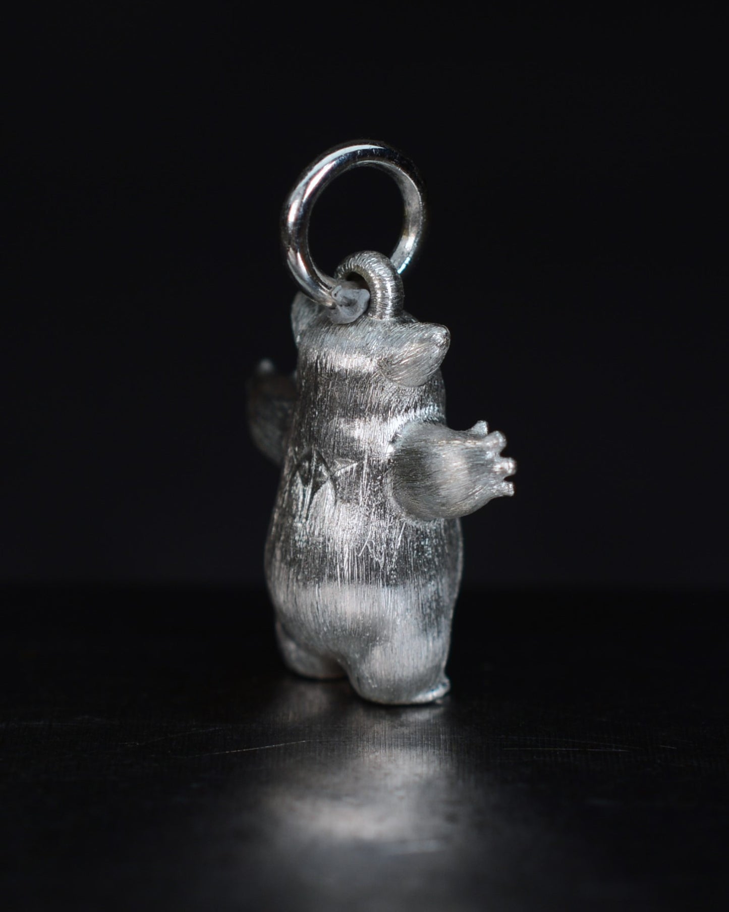 Fox eared pearshape small Bright Creature with a star set natural diamond.