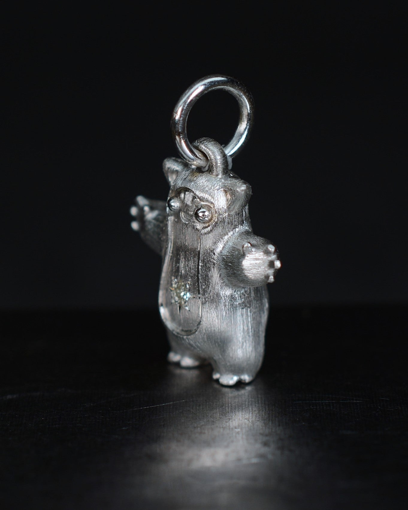 Fox eared pearshape small Bright Creature with a star set natural diamond.