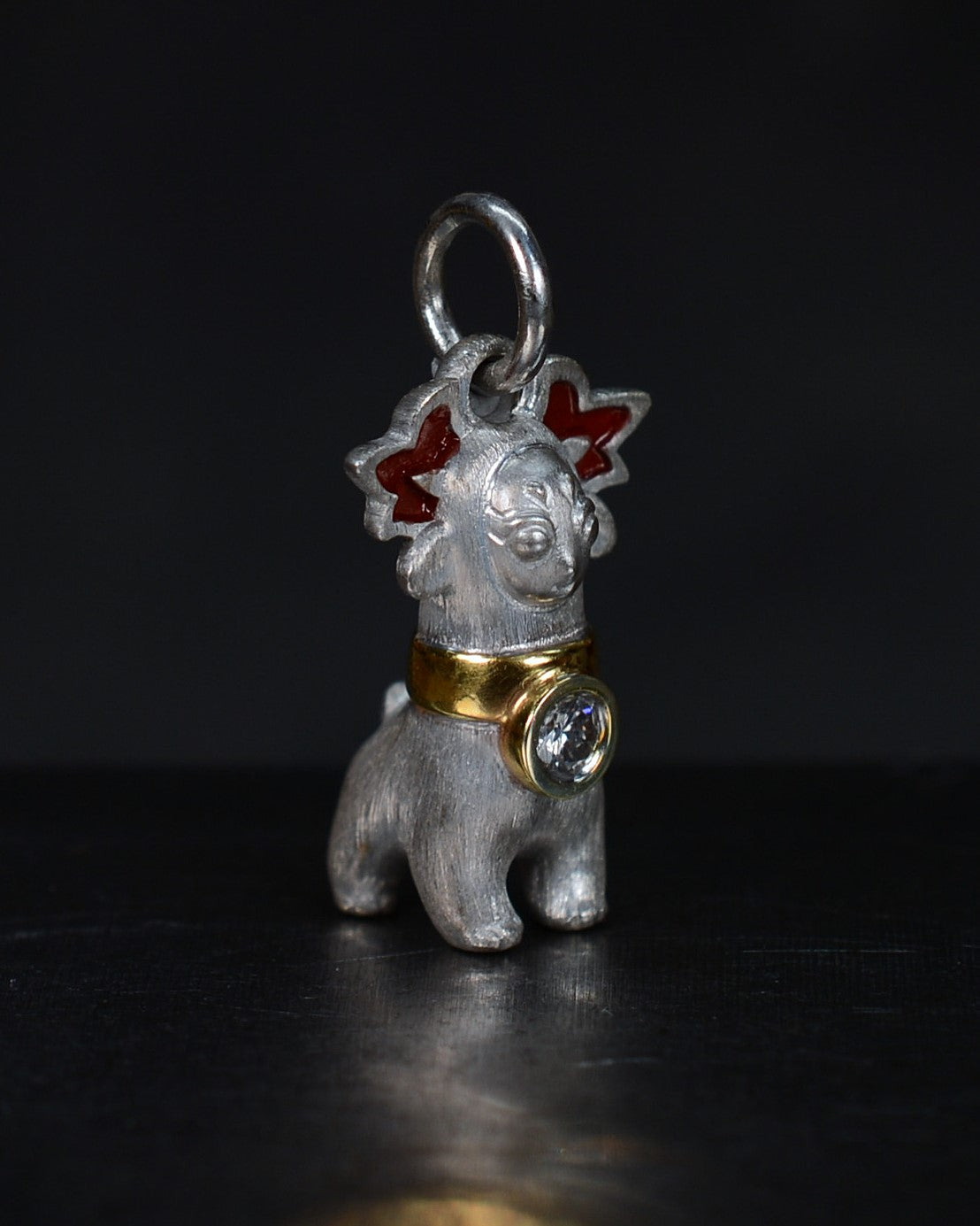 Bright Creature with red antlers and a diamond and parcel gilt collar.