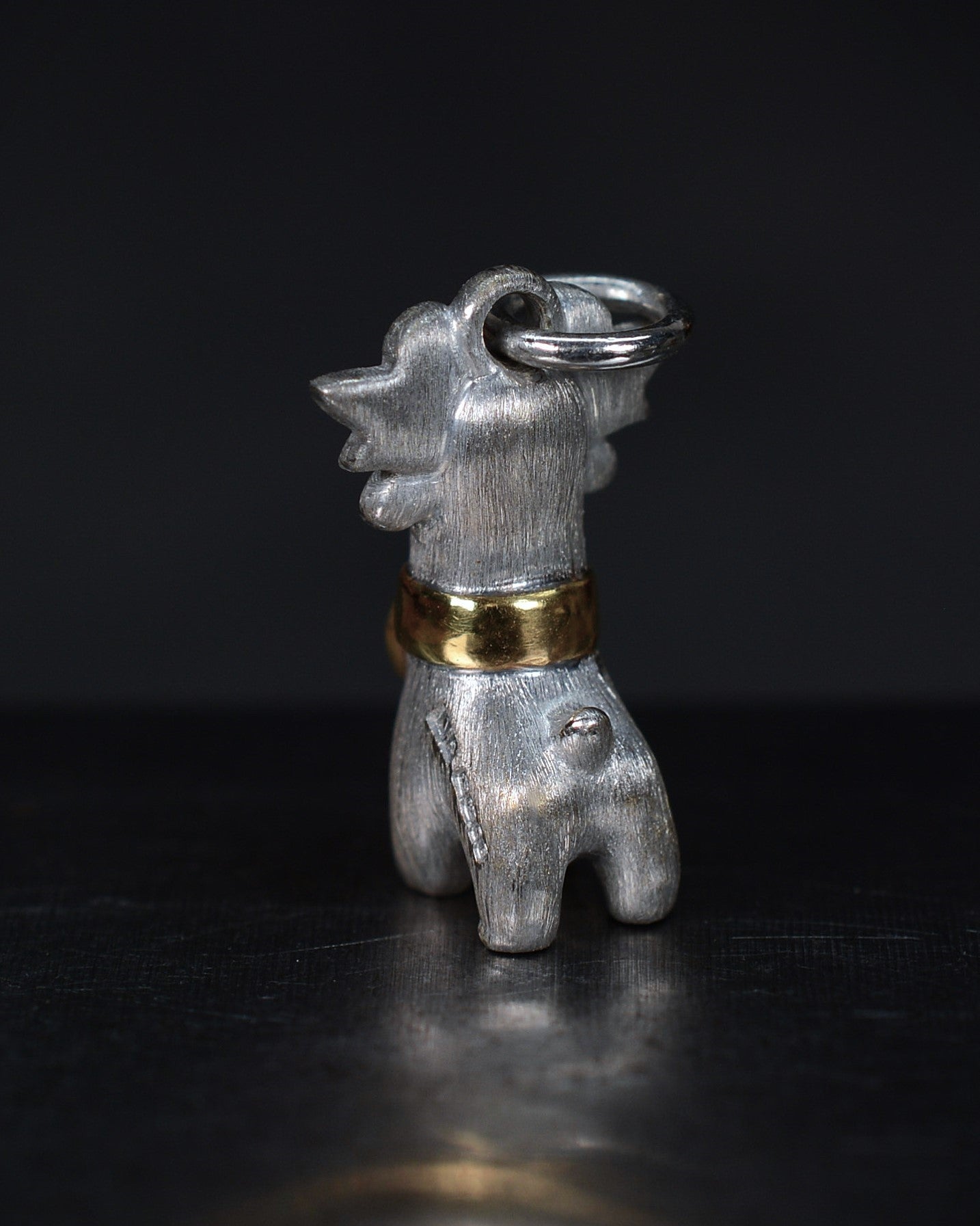Bright Creature with red antlers and a diamond and parcel gilt collar.