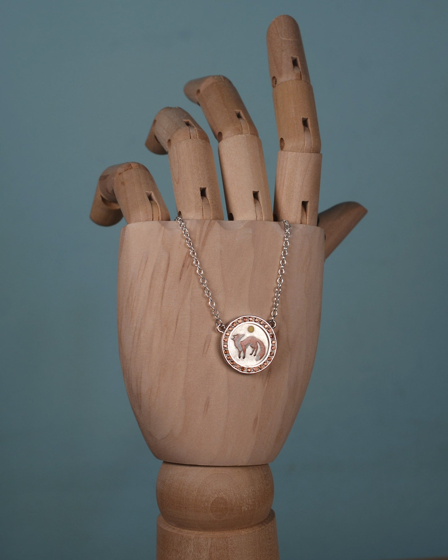 Orange Sapphire and enamel fox pendant and chain.