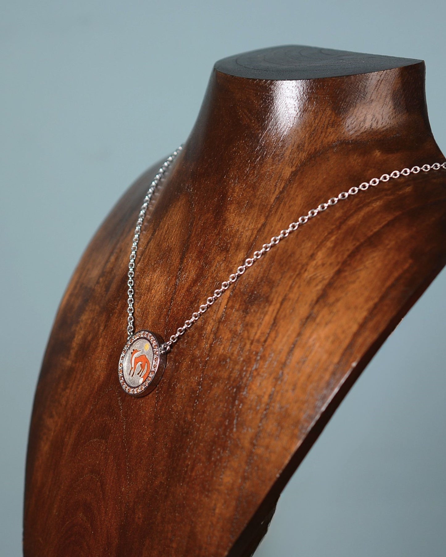Orange Sapphire and enamel fox pendant and chain.