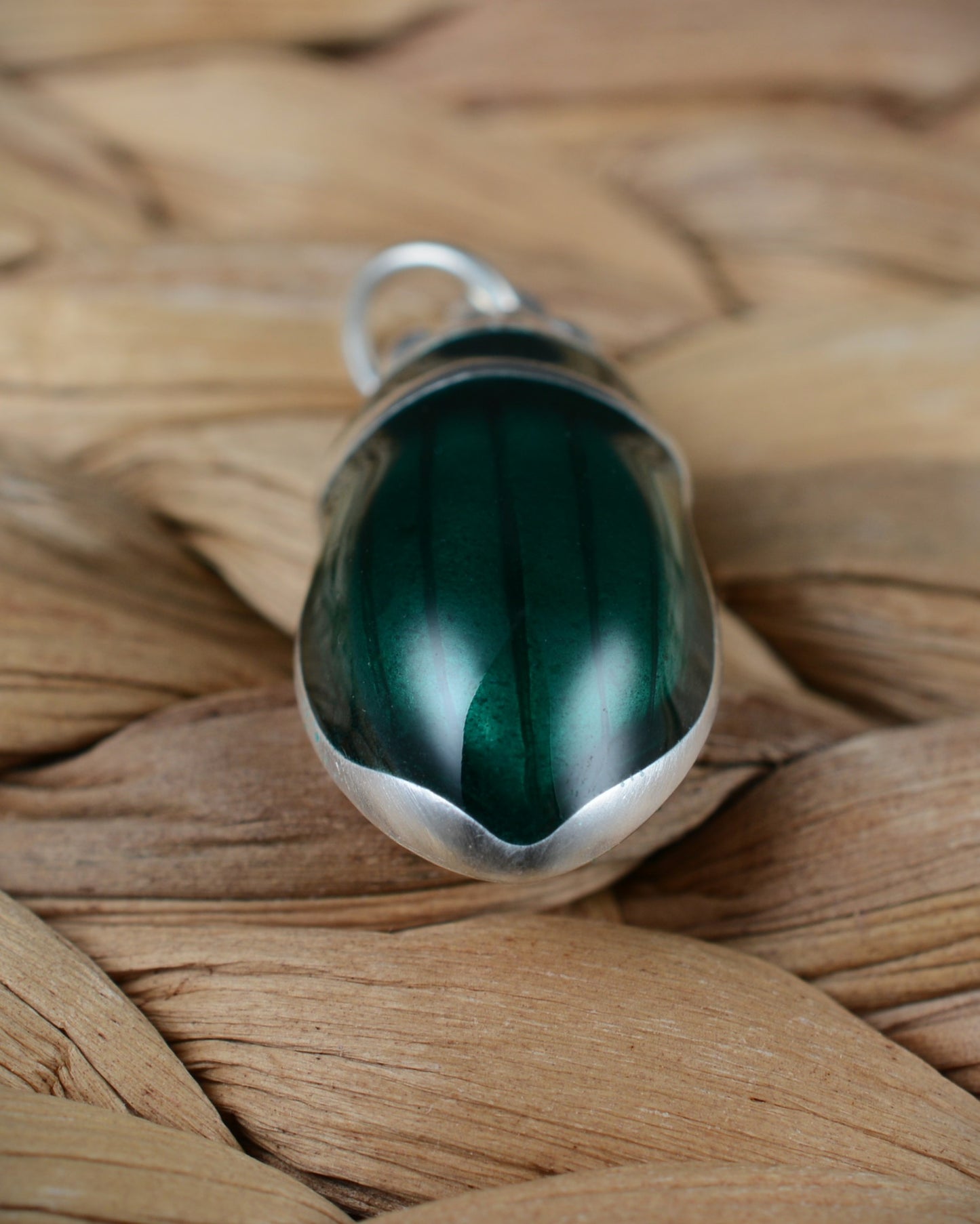 Emerald green beetle pendant. Satin finished silver diving beetle necklace.