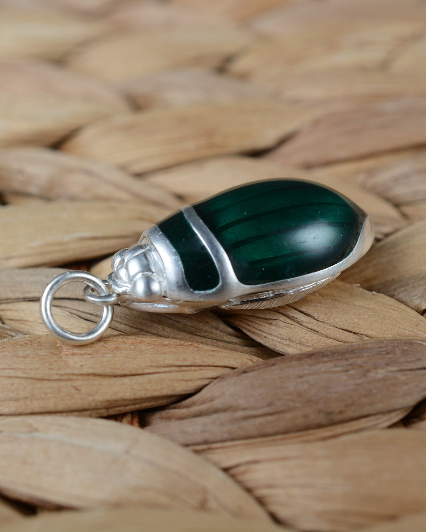 Emerald green beetle pendant. Satin finished silver diving beetle necklace.