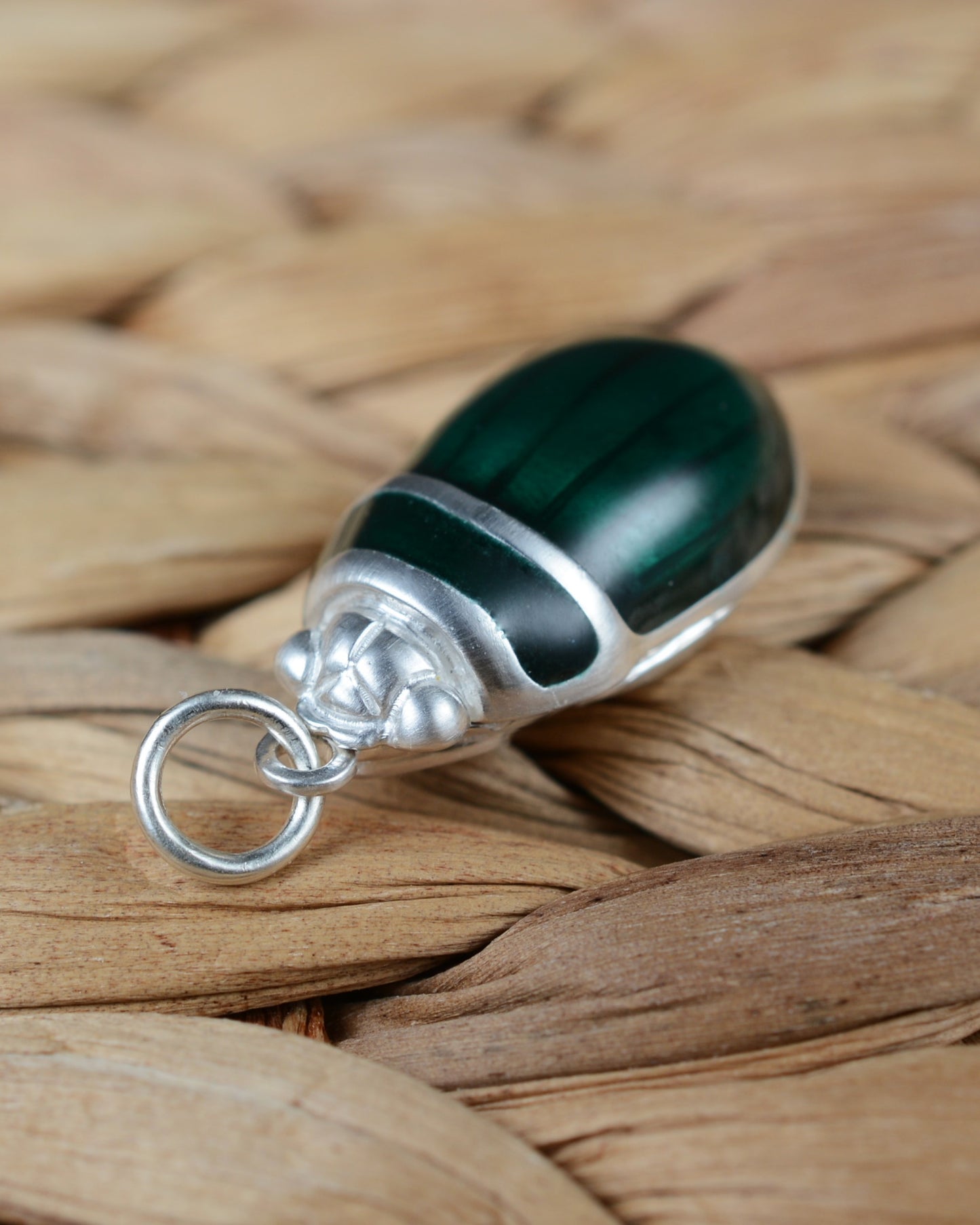 Emerald green beetle pendant. Satin finished silver diving beetle necklace.