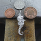 Seahorse necklace. Made from highly polished, tarnish resistant silver, hung on a solid silver chain. © Adrian Ashley