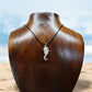 Seahorse necklace. Made from highly polished, tarnish resistant silver, strung on a strong cord. © Adrian Ashley