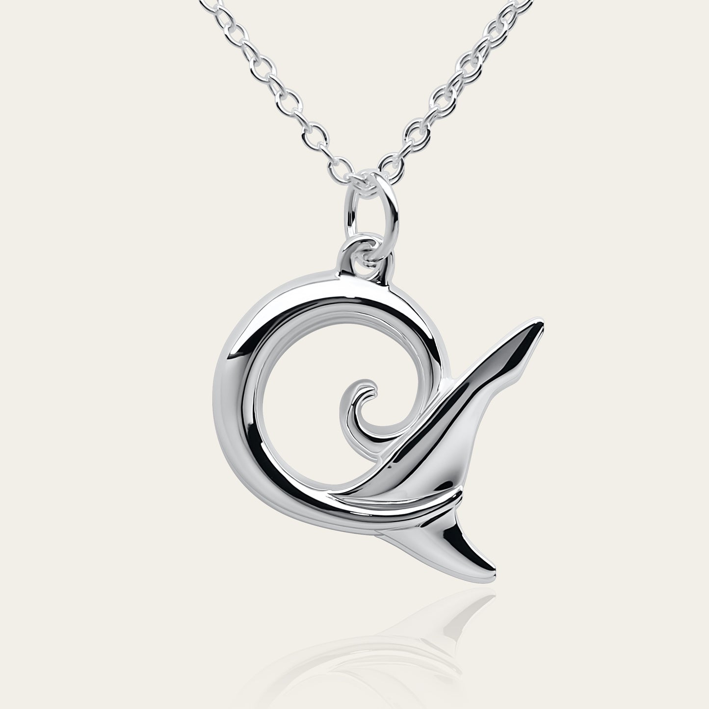 Shark spirit necklace. Made from highly polished, tarnish resistant silver, hung on a solid silver chain. © Adrian Ashley