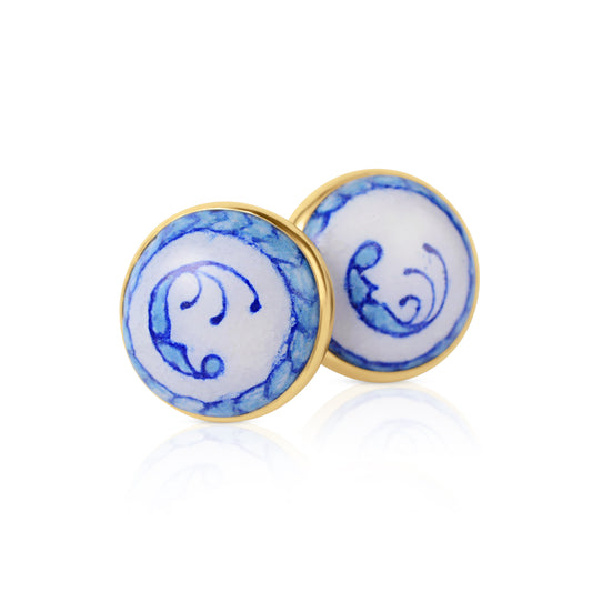 Enamelled gold and silver earrings with a blue motif.