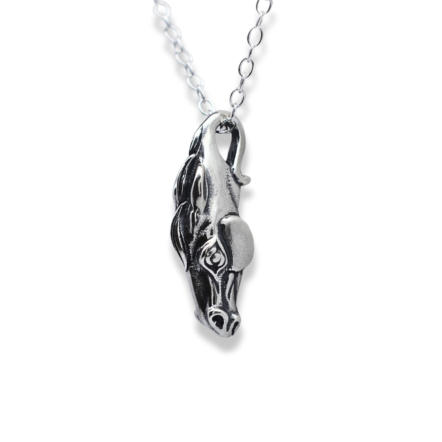 Solid sterling silver horse head pendant and chain. © Adrian Ashley