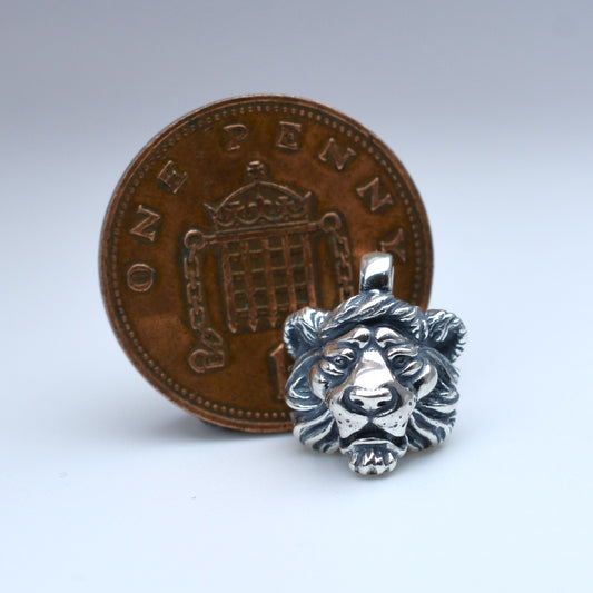 Solid sterling silver lion pendant and chain. © Adrian Ashley