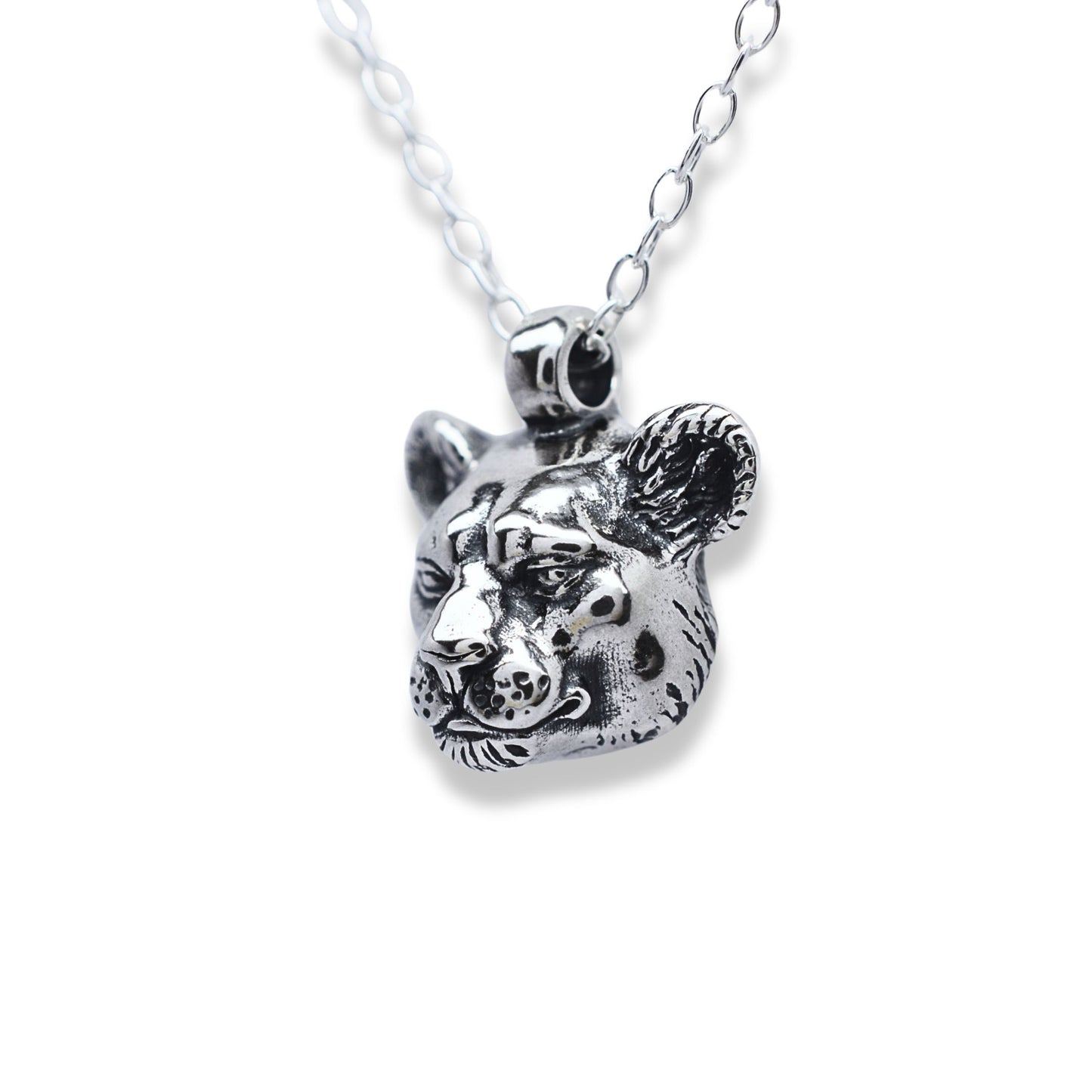 Solid sterling silver lioness pendant and chain. © Adrian Ashley