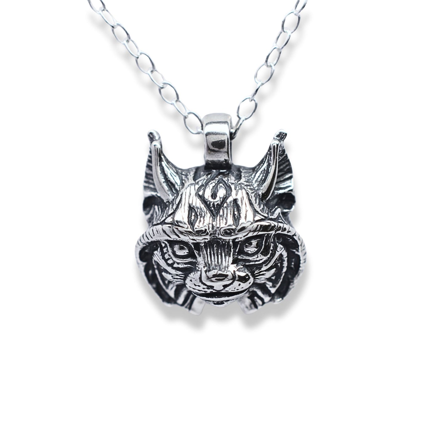 Solid sterling silver lynx pendant and chain. © Adrian Ashley